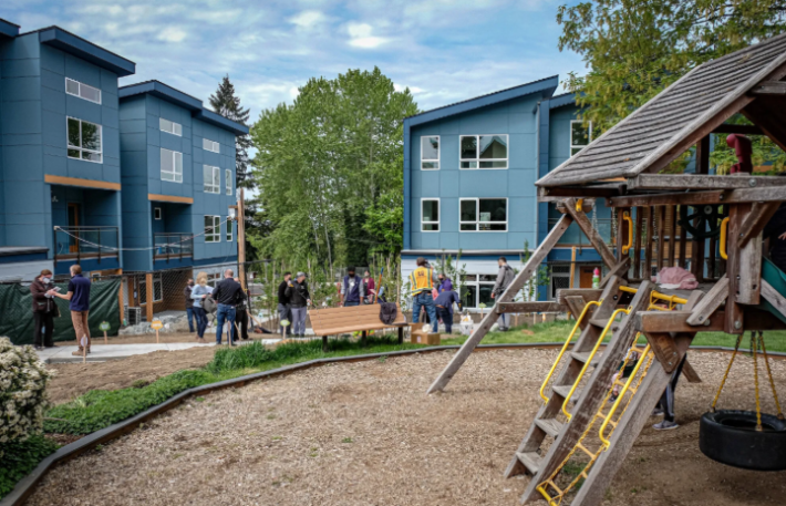 Press conference in front of buildings.