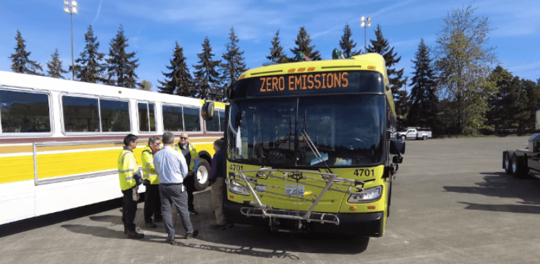 Bus with sign that reads "zero emissions."