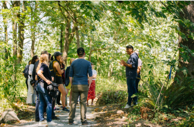 Group of people prepare to take a tour of an urban forest.